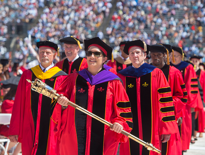 Board of Governors chair Sandy Stewart; honorary degree recipient Governor Phil Murphy; Secretary of the University Kimberlee Pastva, carrying the university mace; President Barchi; and honorary degree recipient Devin McCourty in procession